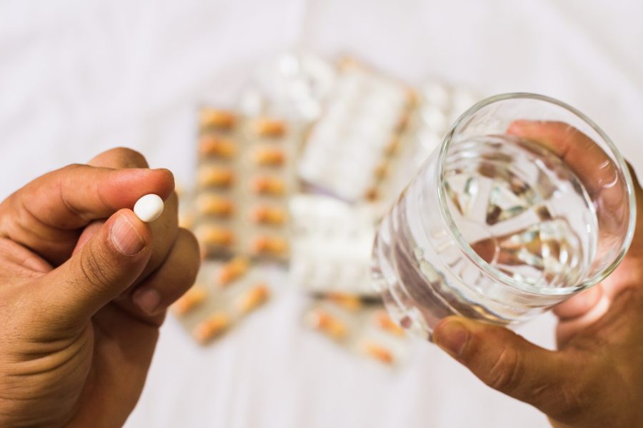 cropped-hands-person-taking-medicine