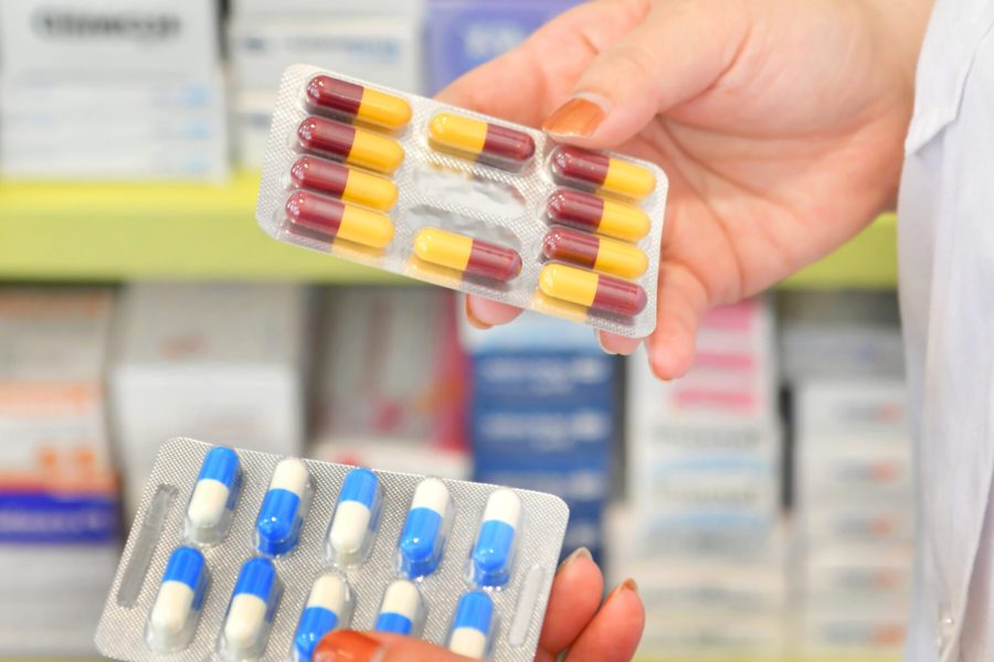 hand-holding-medicine-capsule-pack-pharmacy-drugstore