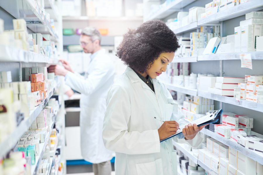 Healthcare, inventory and woman with clipboard in pharmacy for inspection, check and prescription. Medical, professional and pharmacist with checklist of pills for medicine, dispensary or information.