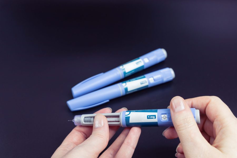 Ozempic Insulin injection pen on a dark background for diabetics and weight loss.