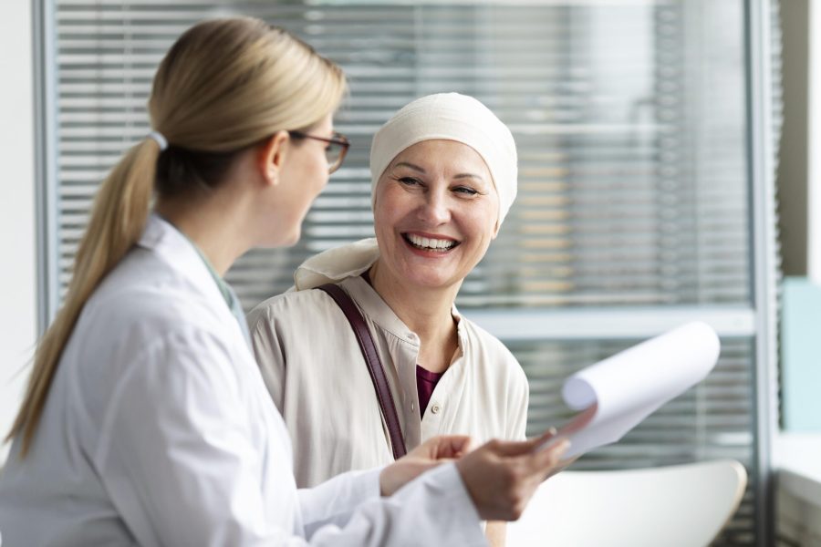 middle-aged-woman-with-skin-cancer-talking-with-her-doctor middle-aged-woman-with-skin-cancer-talking-with-her-doctor
