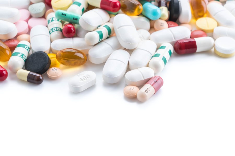 packings of pills and capsules of medicines packings of pills and capsules of medicines on white background