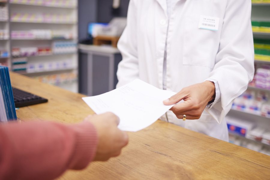 Pharmacy paper, woman hand and customer with prescription and medical bill for payment. Healthcare store, pharmacist and wellness worker holding a survey for pharmaceutical information survey.