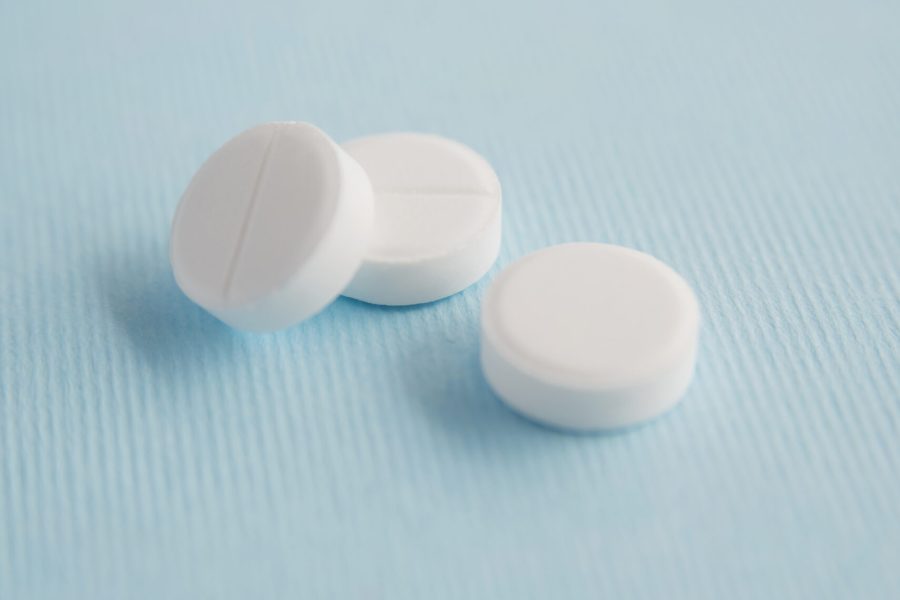 Three white pills isolated